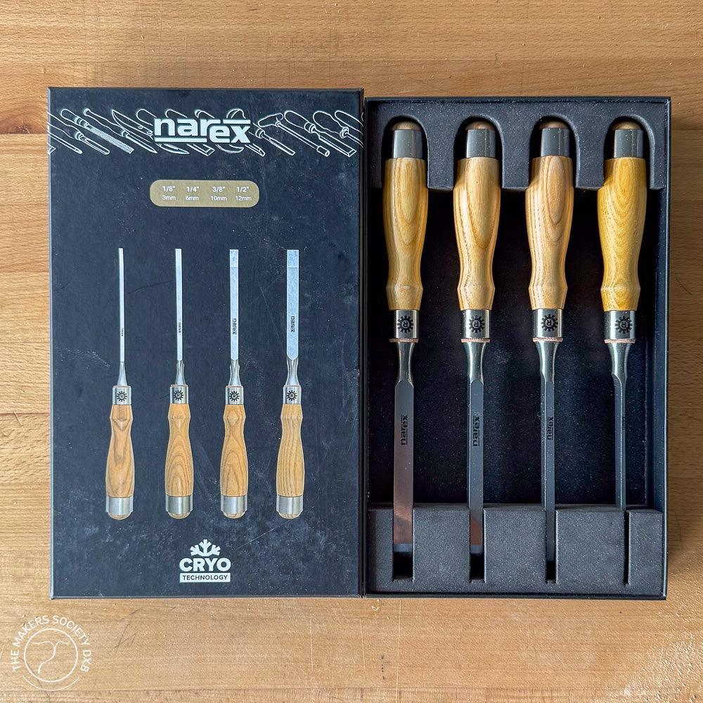 Narex set of four mortise chisels with wooden handles in a black fitted box on wooden surface
