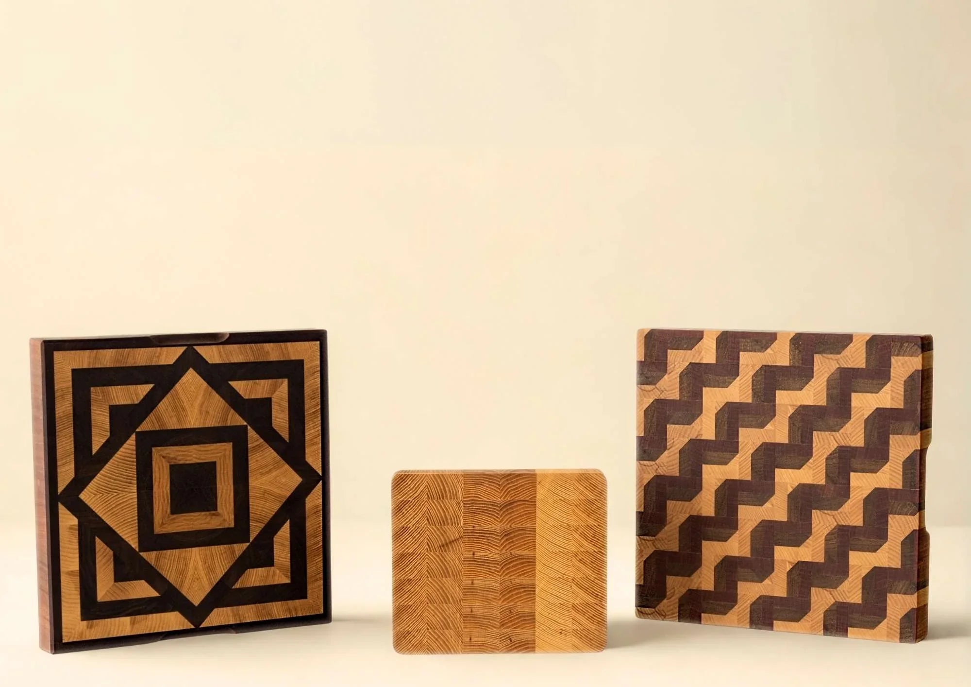 Set of three handmade wooden cutting boards with geometric patterns from The Makers Society