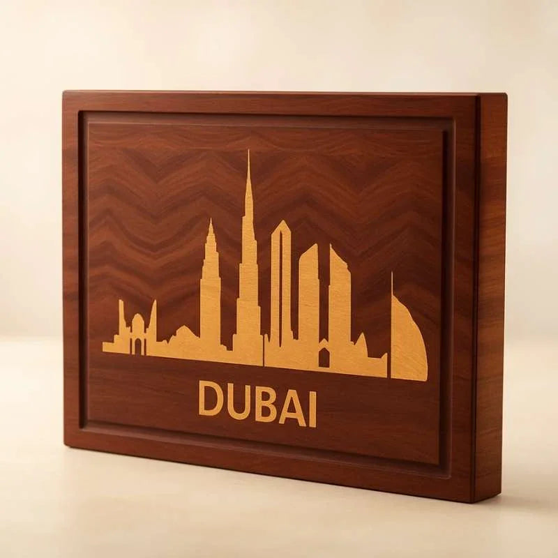 Wooden cutting board with intricate inlay of Dubai skyline and text 'DUBAI', handcrafted home decor