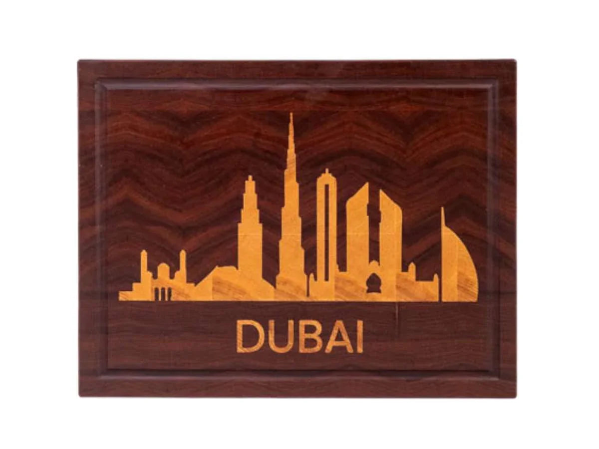 Wooden plaque with Dubai skyline silhouette in lighter wood and text 'DUBAI', handcrafted decorative home goods