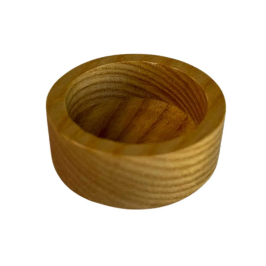Handmade round ashwood candle holder with smooth natural wood grain finish