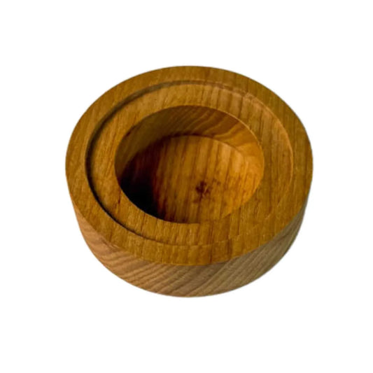 Handmade round wooden tealight candle holder with recessed rim showcasing natural wood grain
