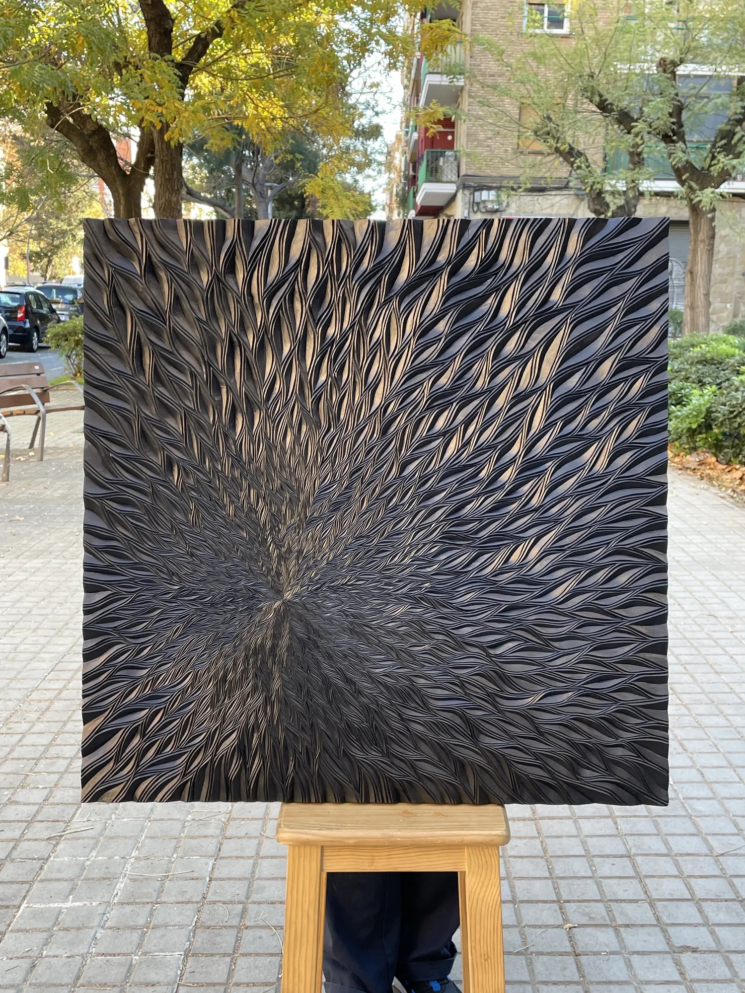 Black chip-carved starburst panel