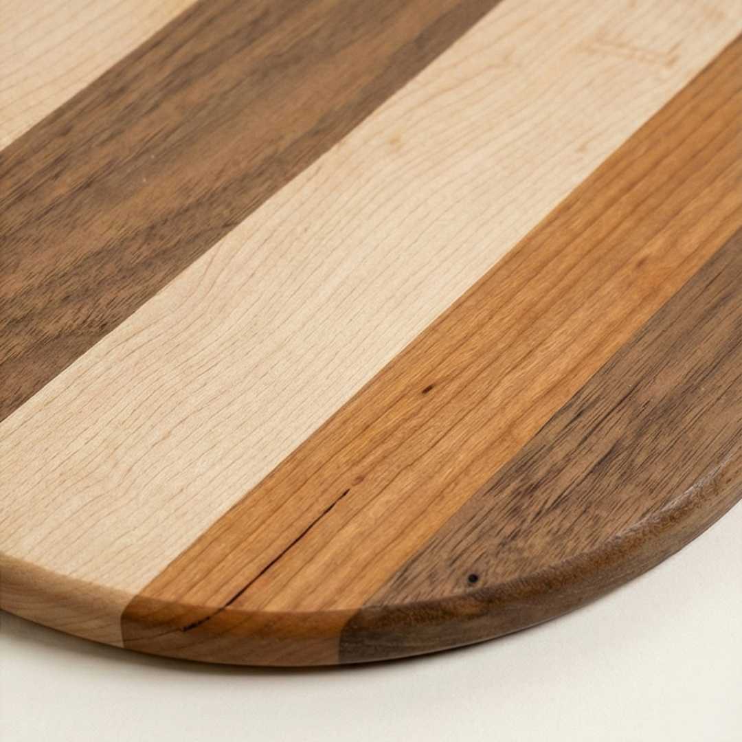 Handmade wooden serving board with natural striped wood grain detail, premium home goods
