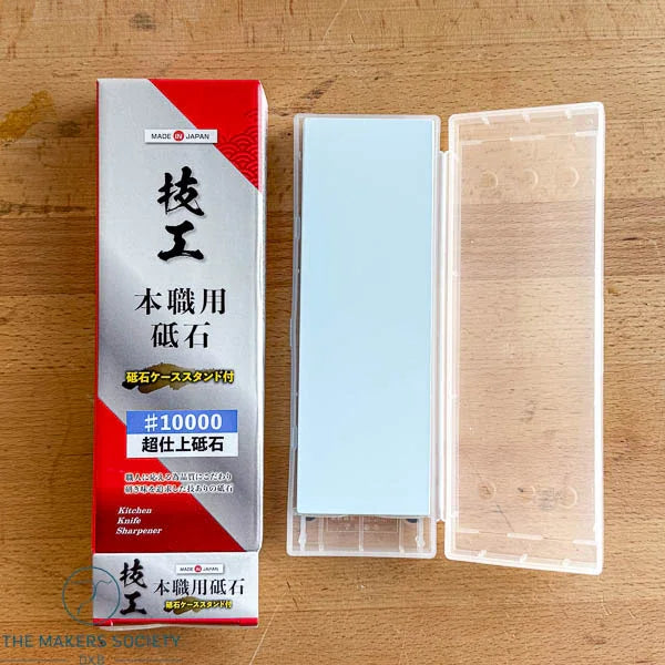 Professional grade Japanese whetstone #10000 with transparent case on wooden surface