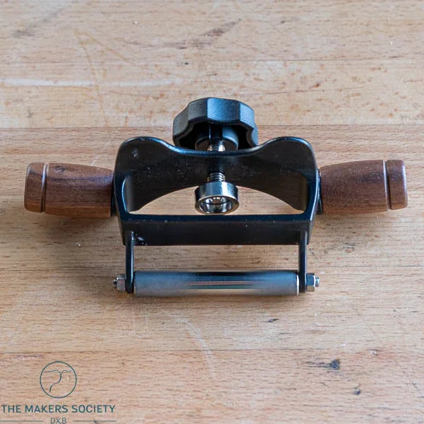The Makers Society KAK HG KBS 50 honing guide with wooden handles and adjustable knob on a wooden surface