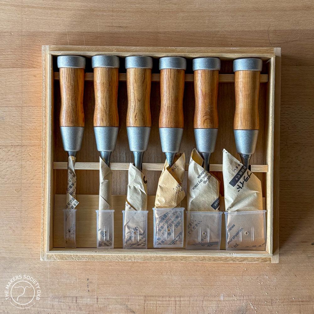 Set of six Kakuri highest grade Damascus woodworking chisels with wooden handles neatly arranged in wooden box