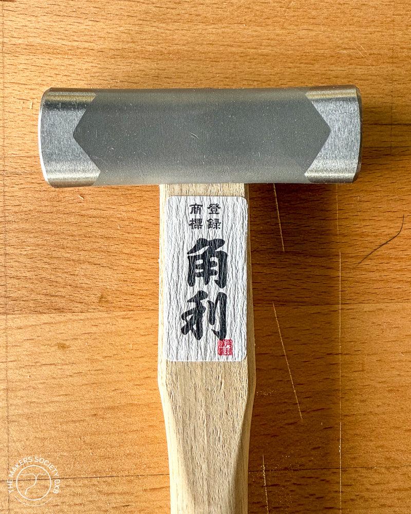Japanese Kakuri square head hammer 225g with wooden handle on wooden surface