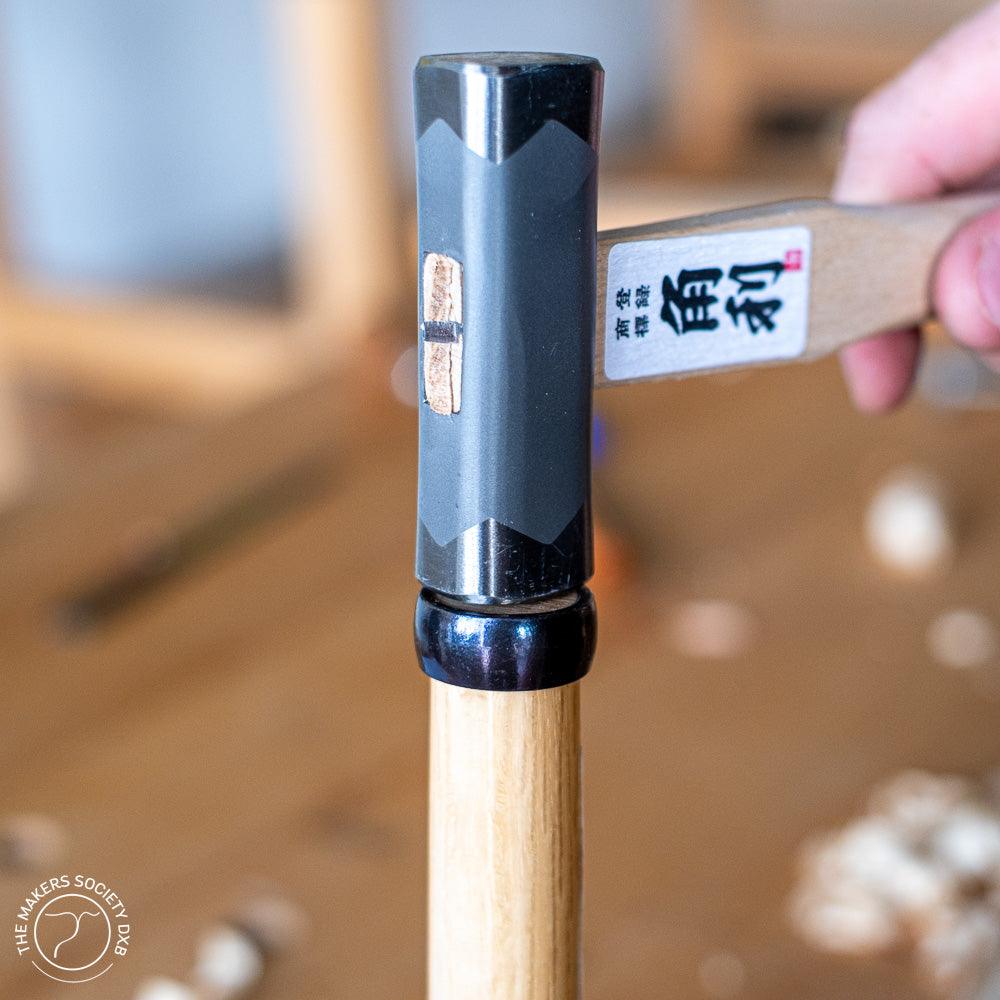 Kakuri 225g square head hammer with wooden handle, held by hand for woodworking at The Makers Society