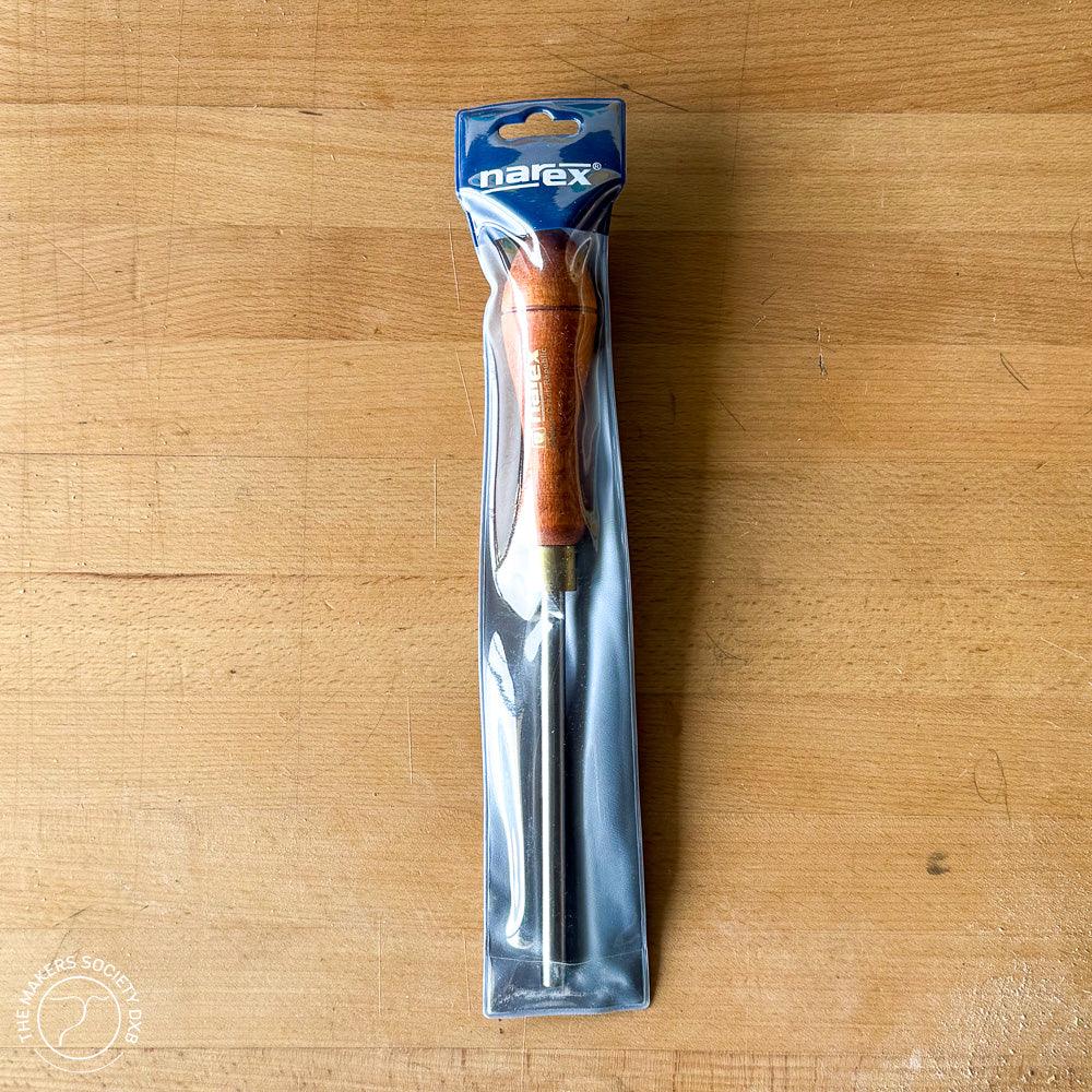 Narex wooden burnisher tool with metal rod in plastic packaging on wooden surface