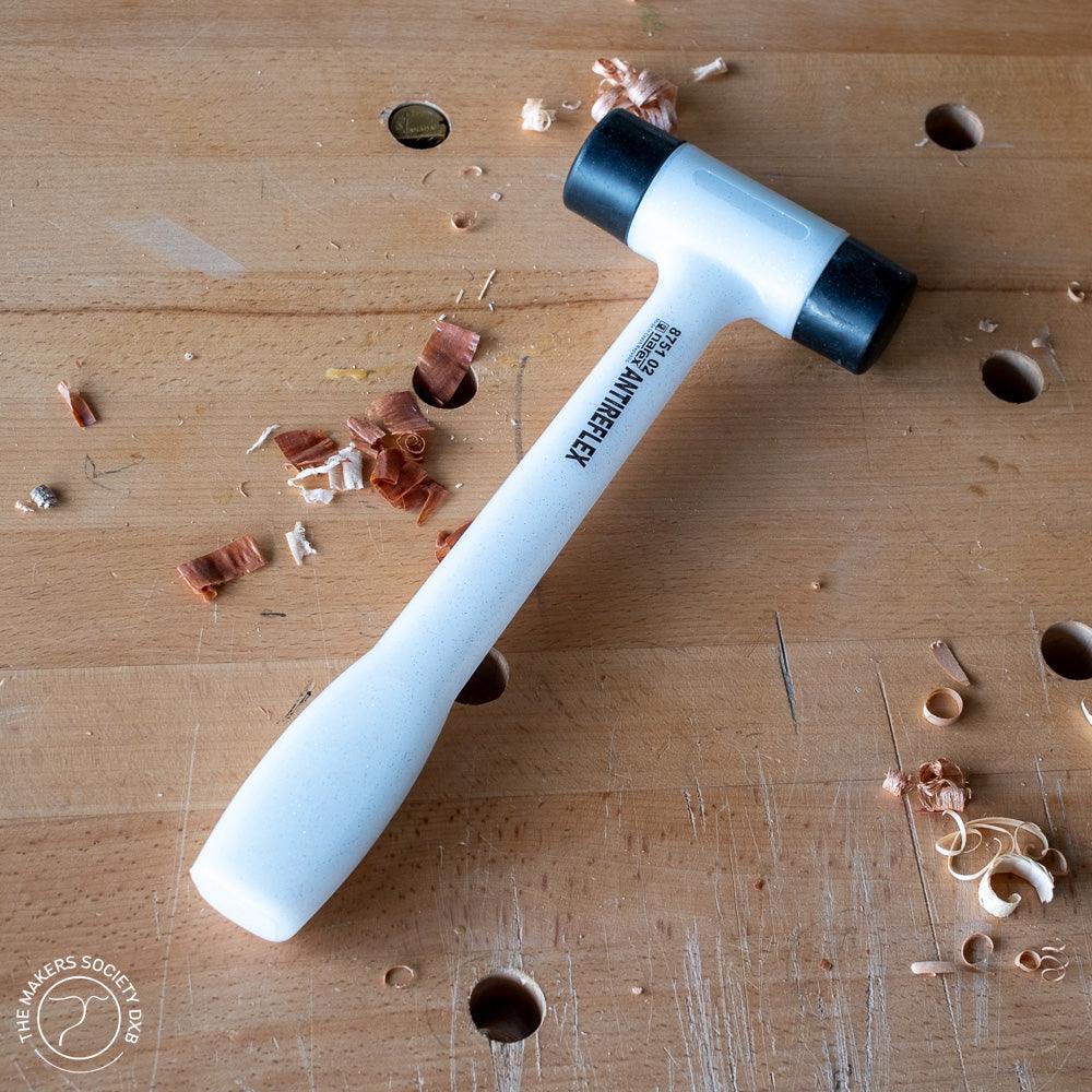 Narex Bouncless mallet with plastic faces on wooden workbench with wood shavings