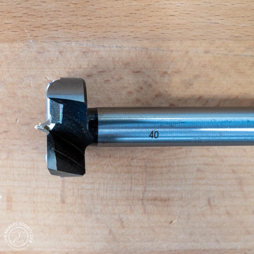 40mm Narex Forstner drill bit with sharp blade edges on wooden surface for woodworking