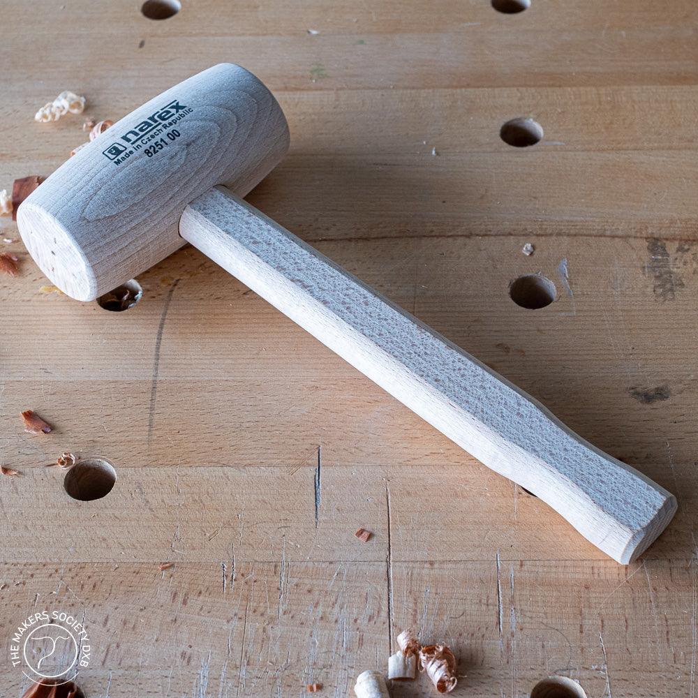Narex 60x120mm wooden joiner mallet resting on a woodworking bench with wood shavings