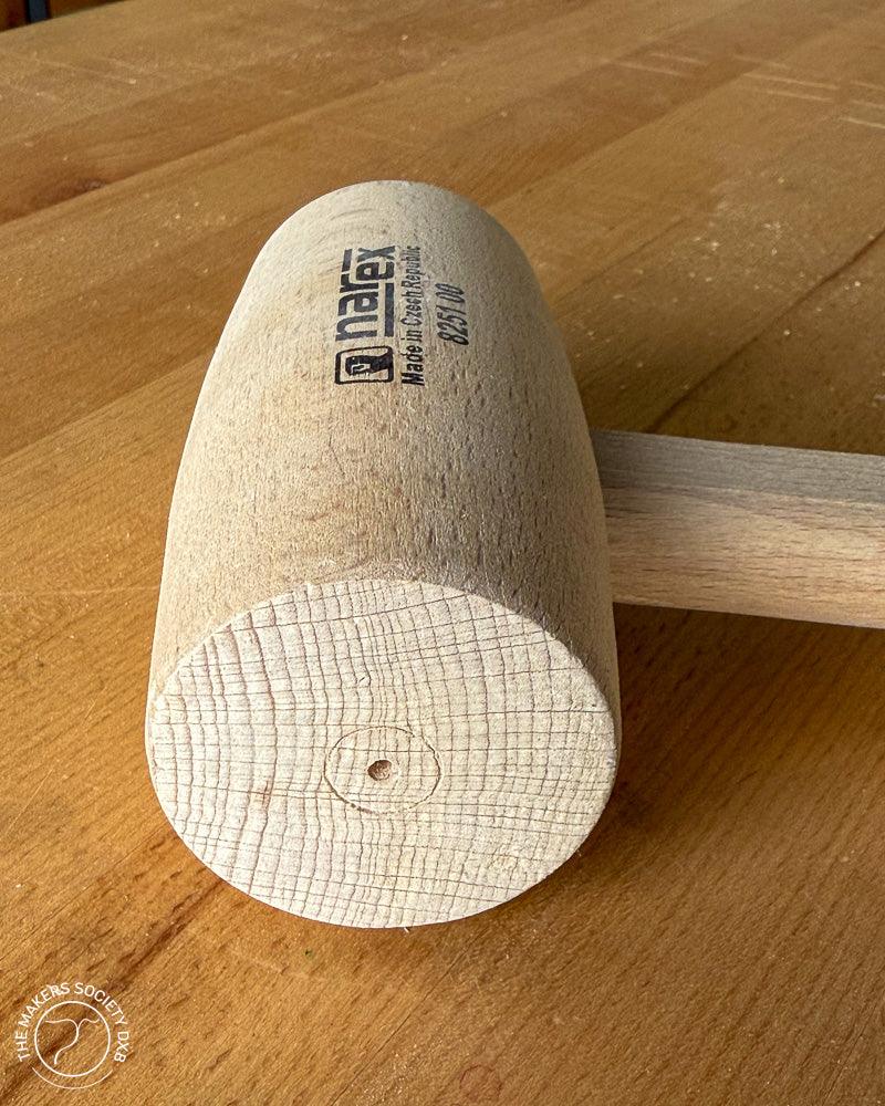 Narex wooden joiner mallet 60x120 mm on a wooden workbench, premium woodworking tool