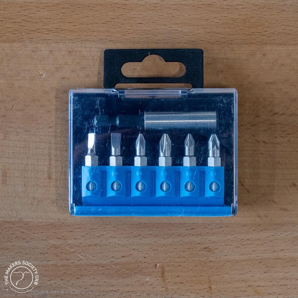 Set of 7 Narex screwdriver bits with magnetic holder in clear plastic case on wooden surface