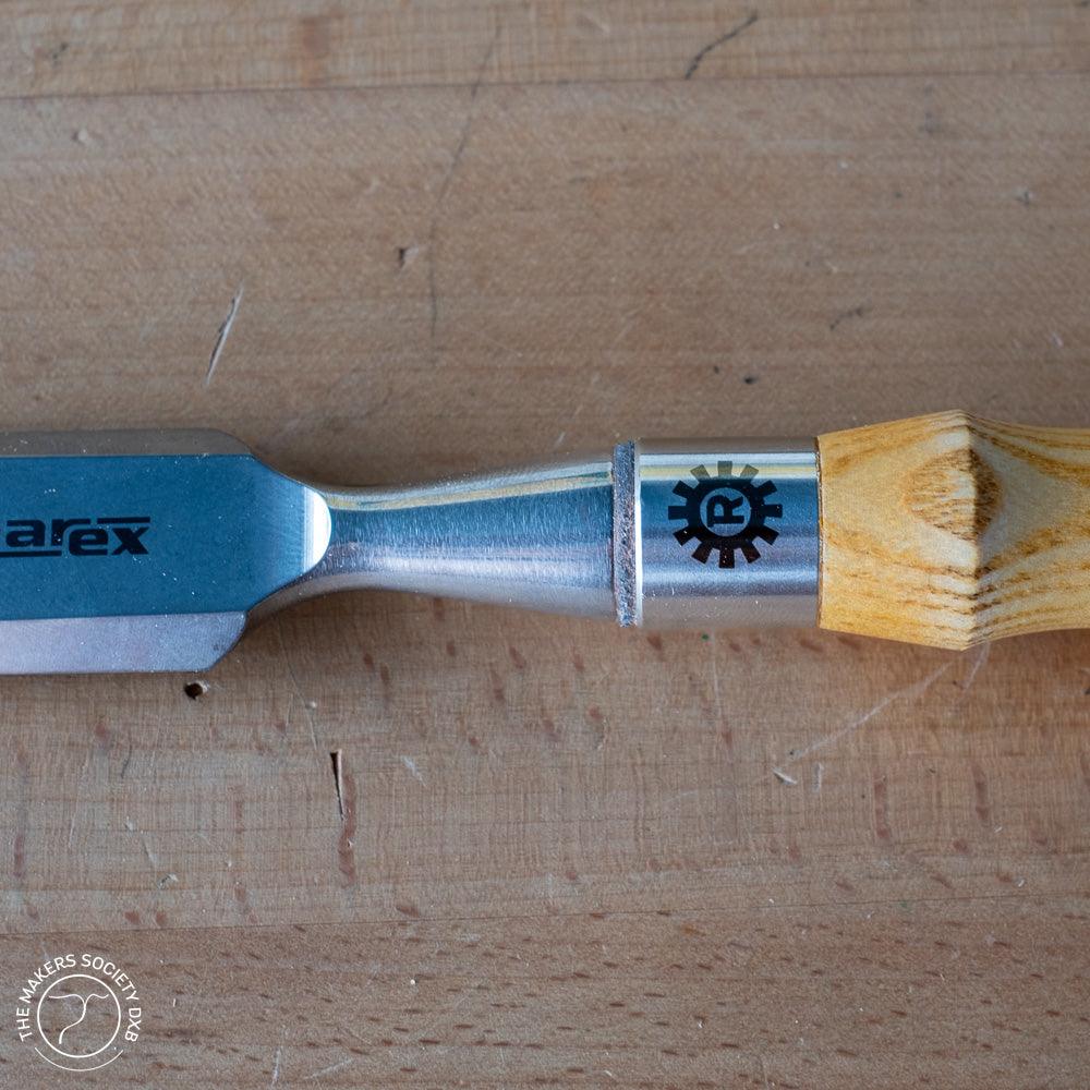 Narex bevel edge chisel with wooden handle on wood surface, woodworking tool from The Makers Society