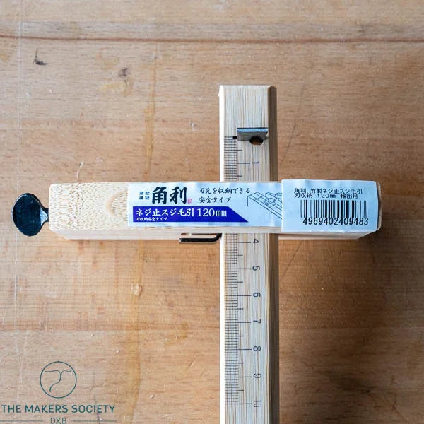 Kakuri 120mm marking gauge with wooden body and metal blade on wooden surface, woodworking tool