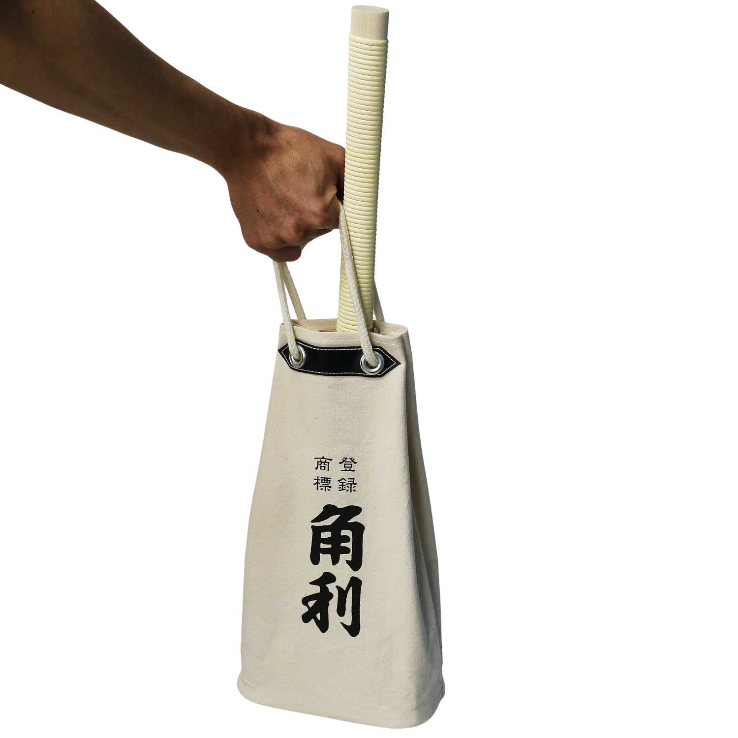 Kakuri canvas tool bag with rope handle, shown being held by hand.