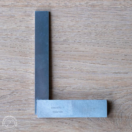 Precision universal square 150x100mm woodworking tool on wooden surface