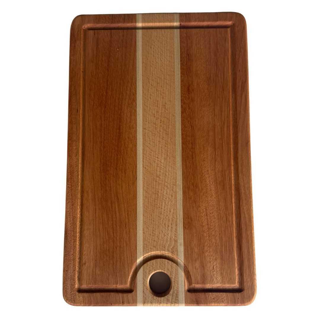 Handmade wooden kitchen serving board with maple, cherry, and ash wood stripes featuring a juice groove and round finger hole