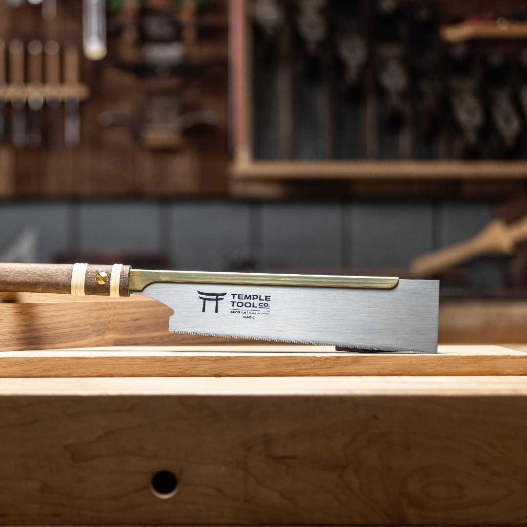 Temple Tool Dozuki pull saw with fine crosscut blade and wooden handle on woodworking bench