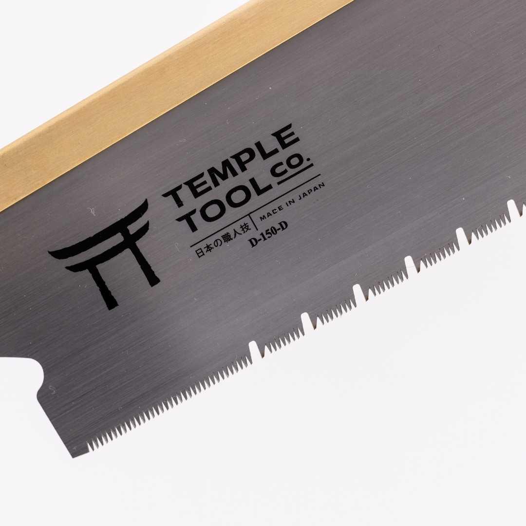 Close-up of Temple Tool Co. D-150-D Japanese pull saw blade with fine teeth and brass spine