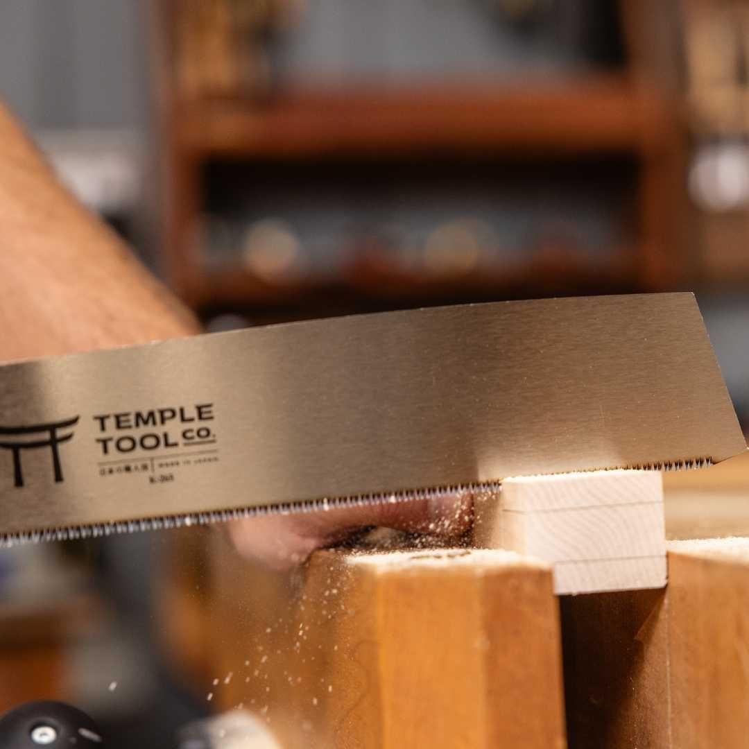 Temple Tool Co. Kataba pull saw cutting through wood in a woodworking shop