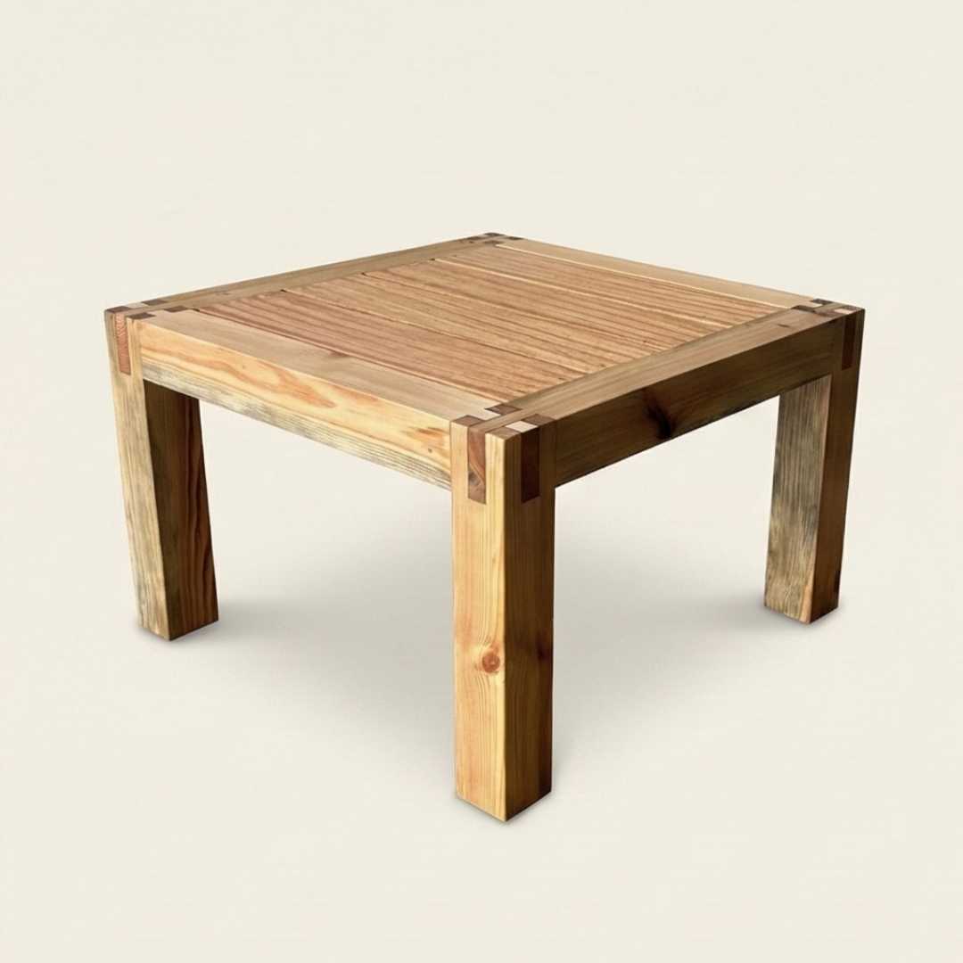 Wooden table with a rustic design on a plain background