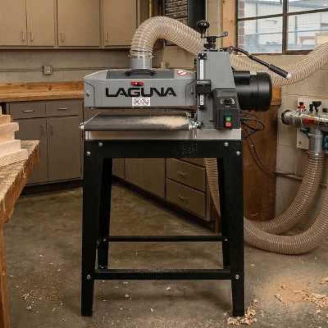Woodworking machine with 'Laguna' branding in a workshop setting