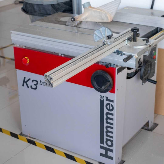 Table saw with 'Hammer' branding on a tiled floor