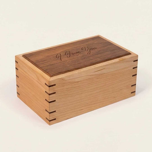 Wooden box with 'I Love You' engraving on a beige background