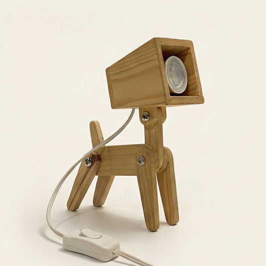 A premium, handcrafted articulated wooden desk lamp shaped like a dog. Shown at a three-quarter angle on a clean off-white background with soft studio lighting, highlighting its natural pine grain and square spotlight head.