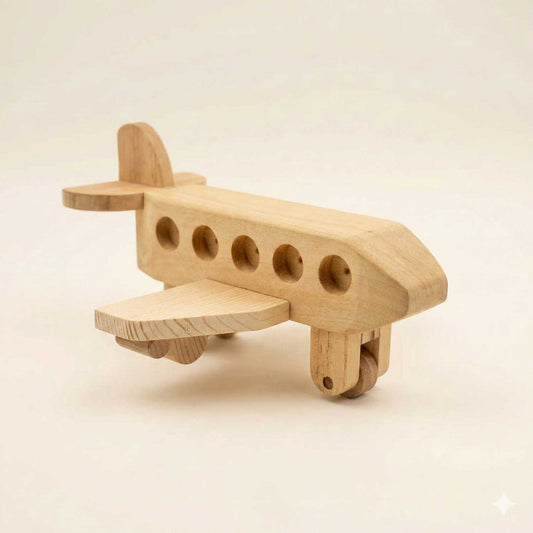 A high-end handcrafted wooden toy airplane with a natural grain finish, featuring five circular windows and smooth-sanded edges, displayed at a three-quarter angle on a clean off-white studio background.