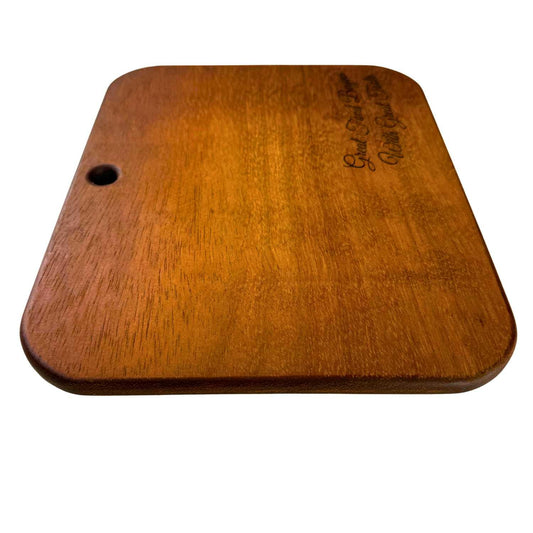 Rectangular Iroko wood serving board with rounded edges and a hole for hanging