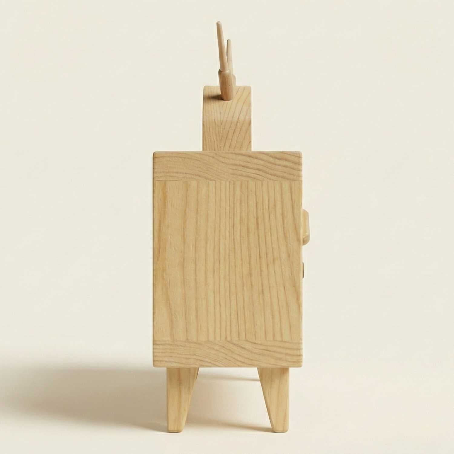 Wooden easel with paintbrushes on a beige background