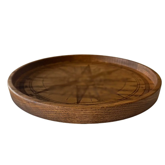 Handmade round wooden tray crafted from red oak with compass design engraving