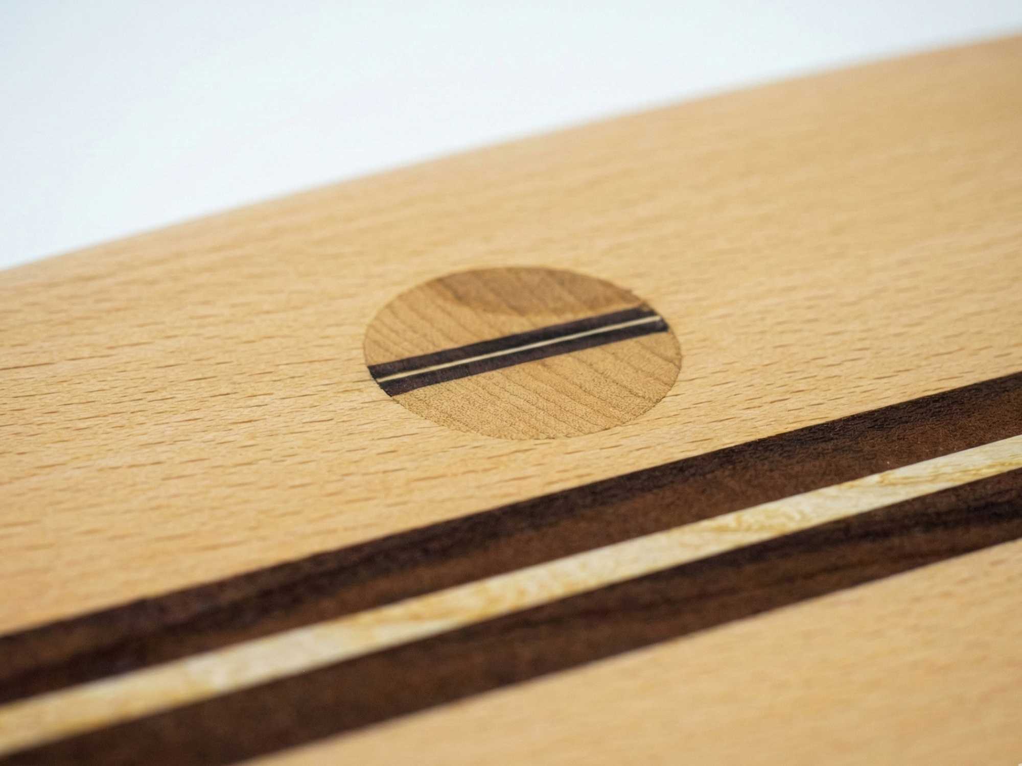 Close-up of handcrafted wood joinery with circular inlay detail by The Makers Society Dubai