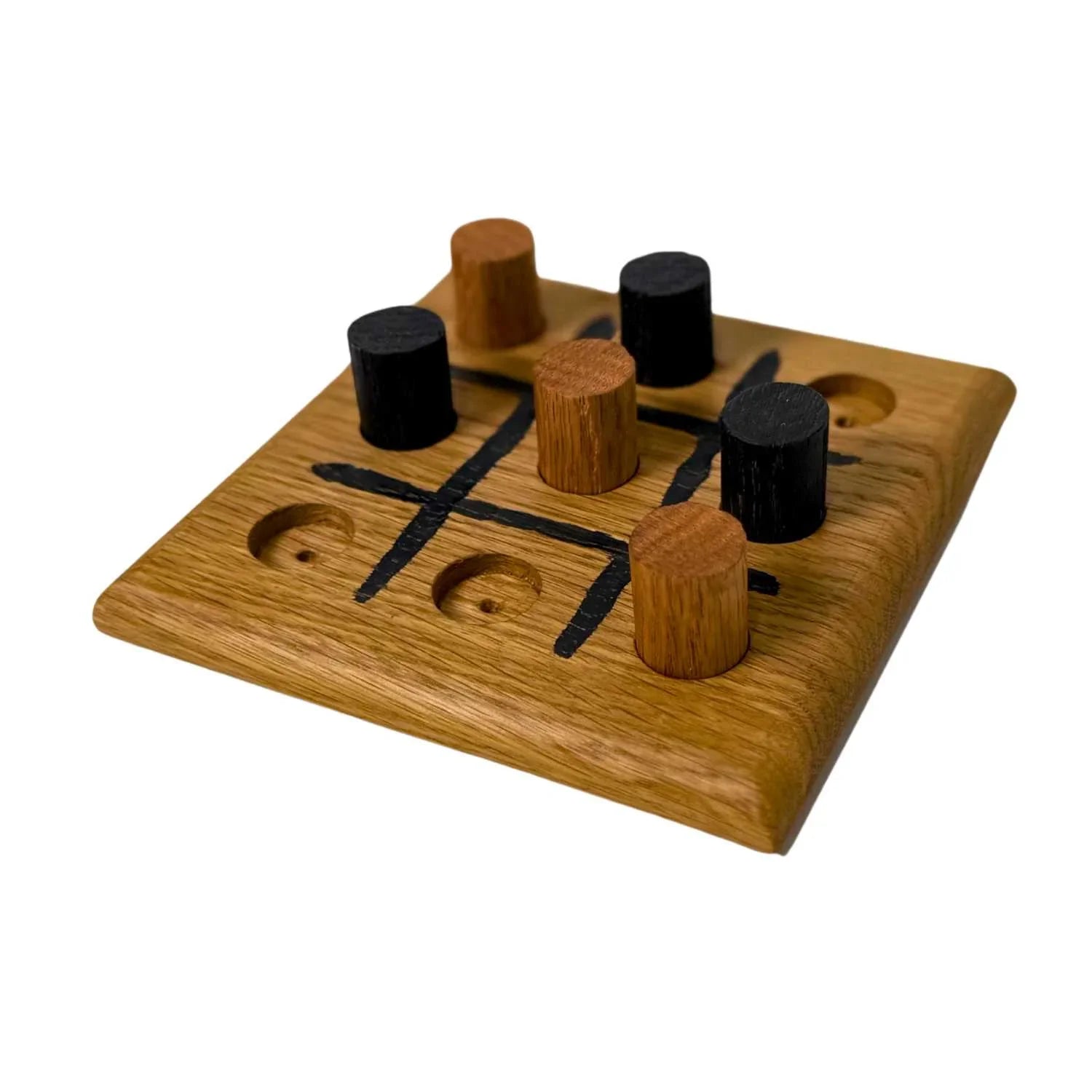 Handmade wooden tic-tac-toe game with black and natural wood pegs on oak board
