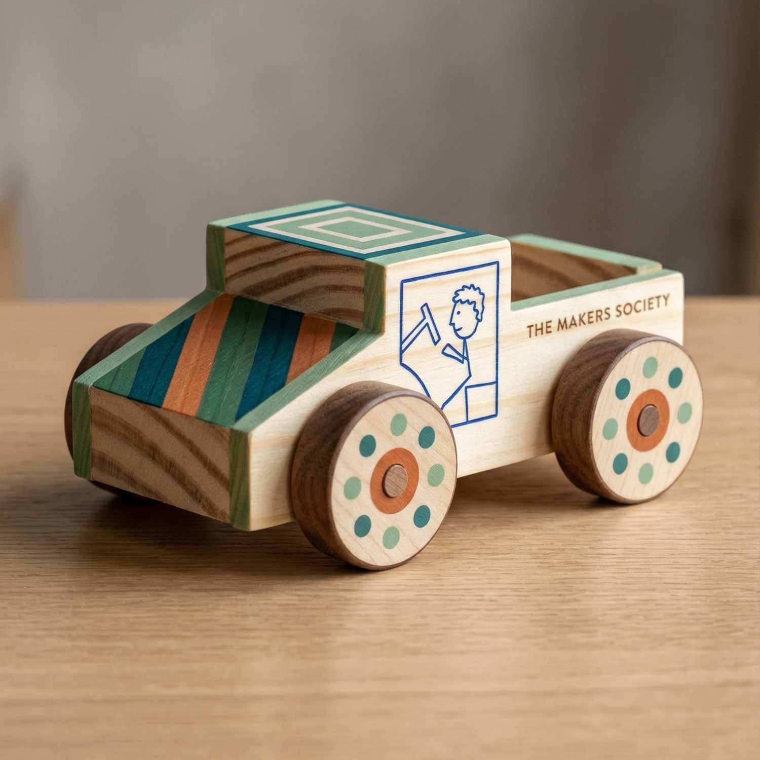 Finished wooden race car from The Makers Society kids woodworking kit with hand-decorated details