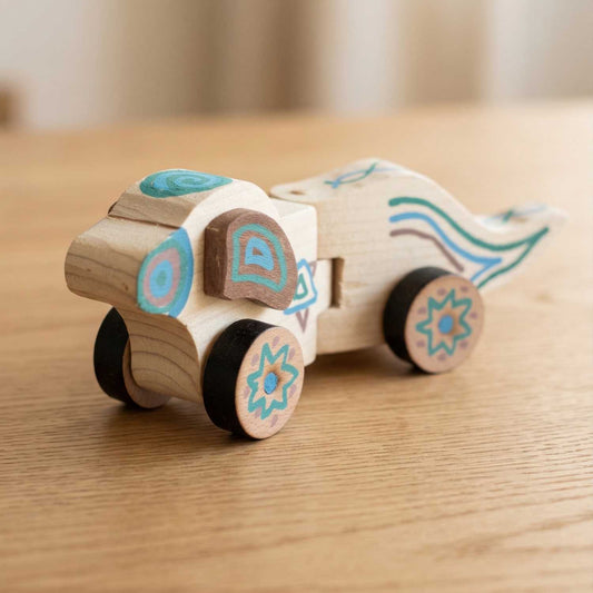 Finished wooden puppy pull-along from The Makers Society kids woodworking kit with hand-decorated details
