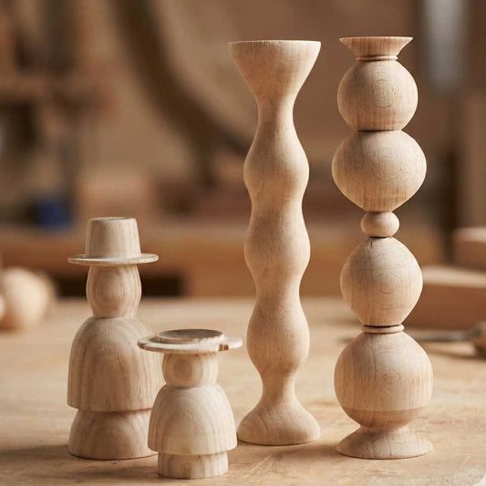 Turned wooden spindle samples showing different profiles made in a beginner woodturning class at The Makers Society in Dubai.